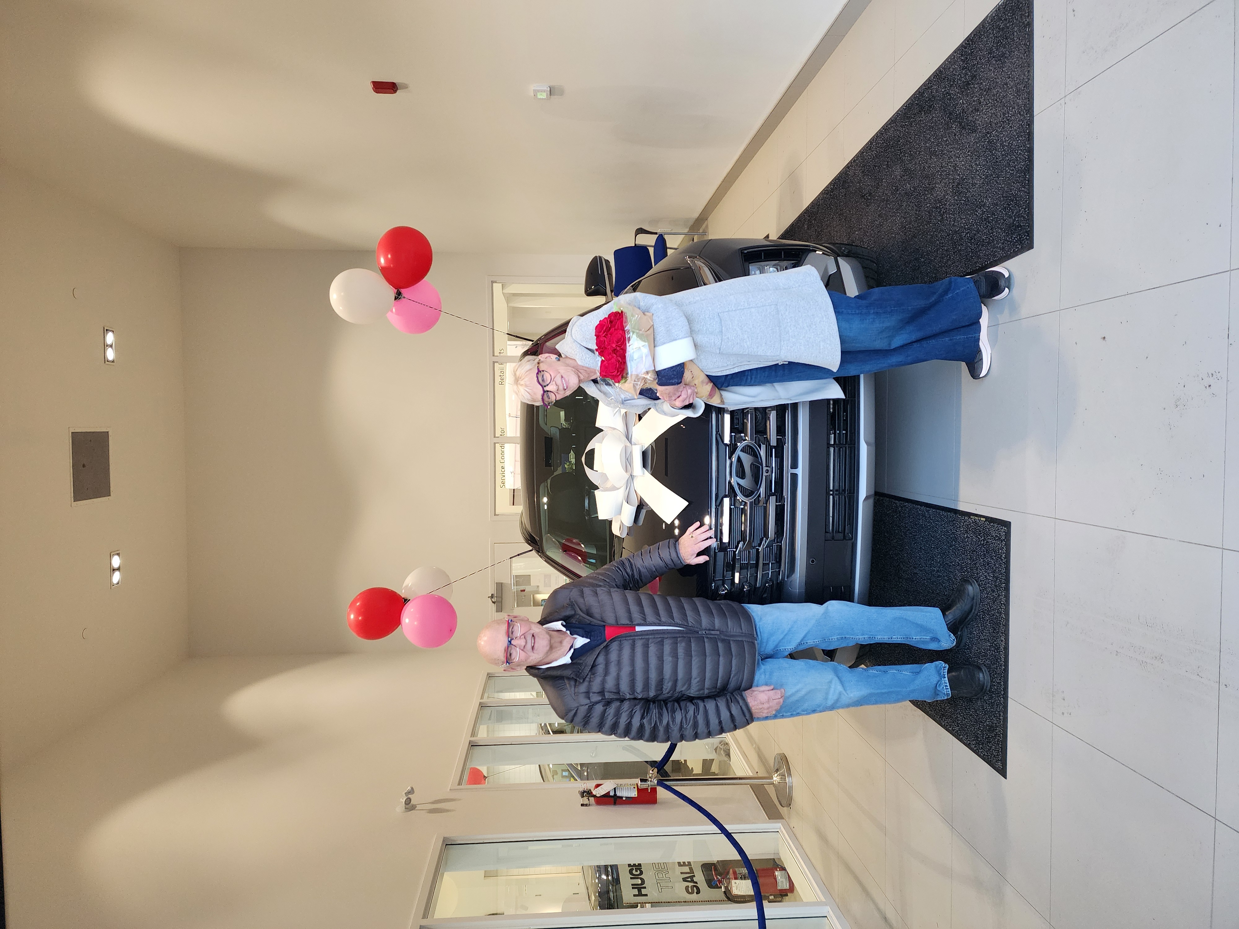 Customers celebrating new car purchase