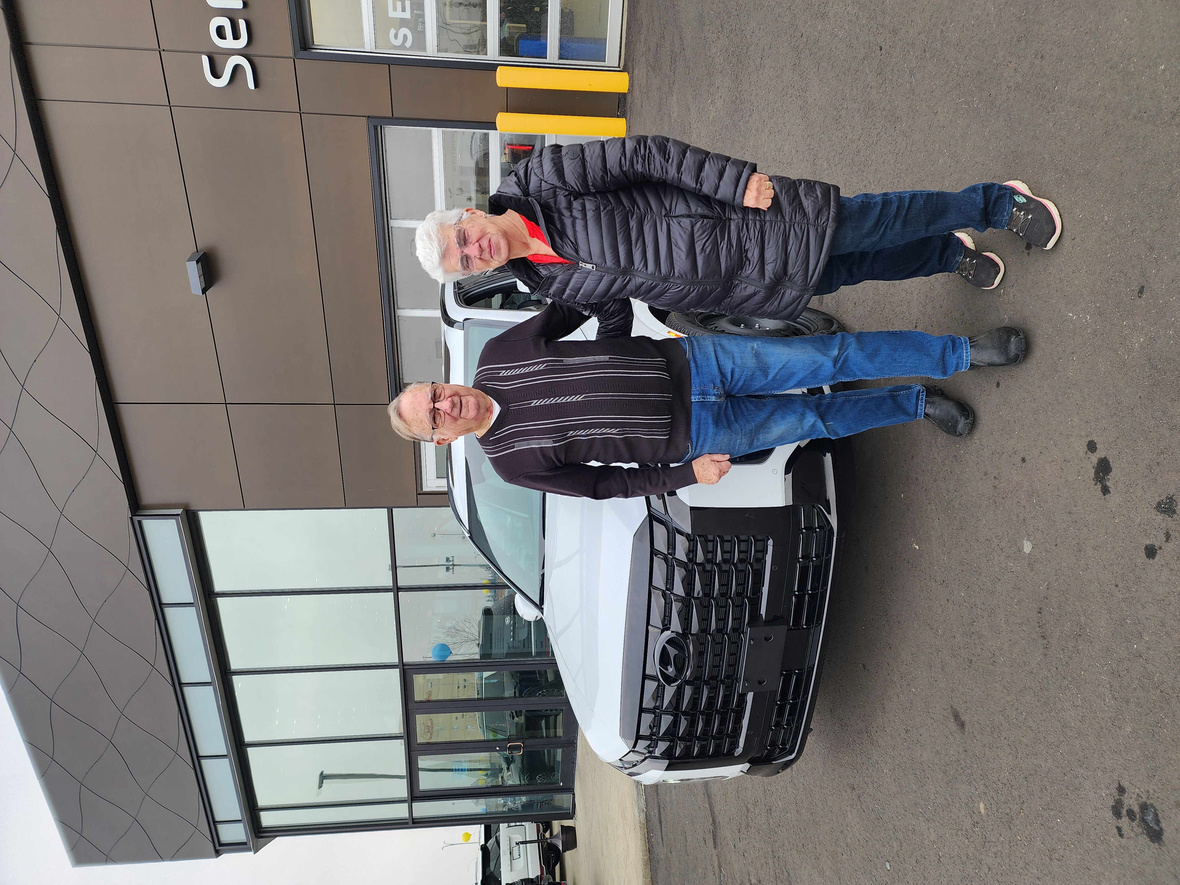 Couple with their new SUV